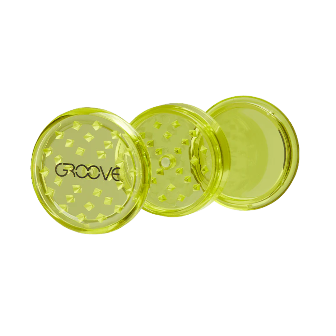 Bright green Groove acrylic grinder with sharp shredding teeth and storage compartment. Lightweight and travel-ready.