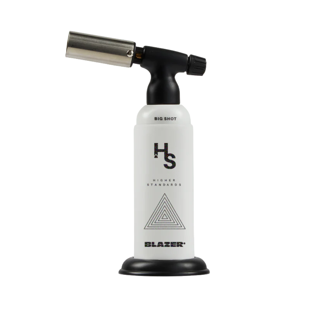Higher Standards x Blazer Big Shot Torch V3 – White Triangles edition, 2500°F flame, available at Consider It Flowers.