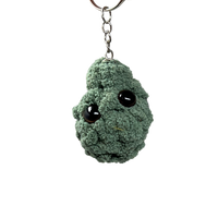 Solid green plush nug keychain with minimal stitching and black eyes, honoring the classic Jack Herer cannabis strain. Handmade in Nashville.
