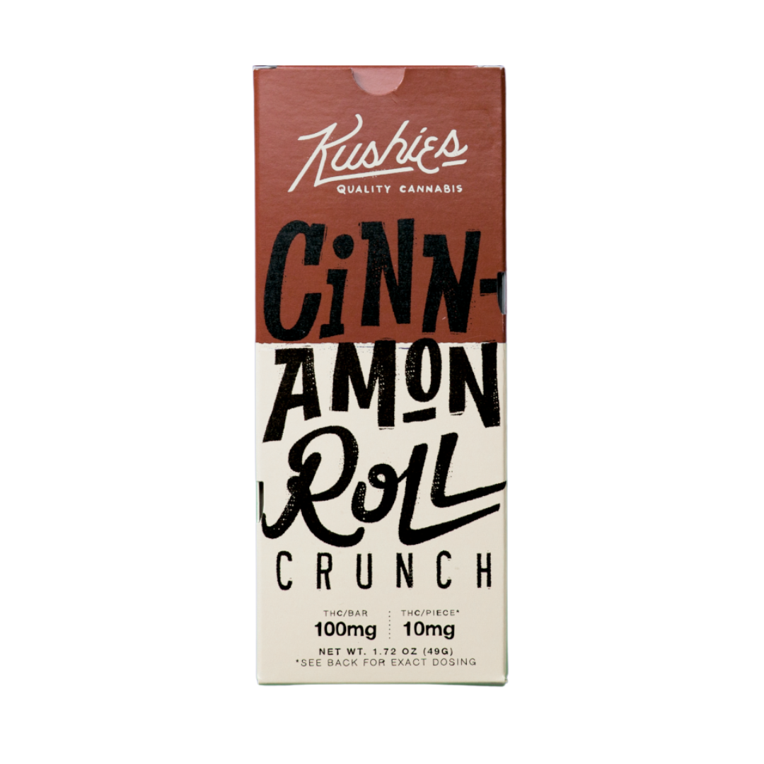 Kushie’s Cinnamon Roll Crunch Cannabis Chocolate Bar – creamy white chocolate with crunchy cinnamon cereal pieces, 100 mg THC available at Consider It Flowers.