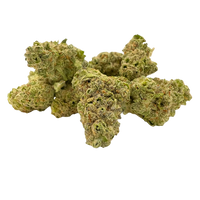 Strawberry Cough Premium Smalls – sativa strain with sweet strawberry flavor, peppery exhale, uplifting effects, and frosty neon green buds.