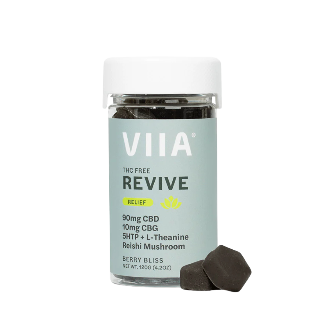 VIIA Revive CBD Relief Gummies in Berry Bliss flavor with two sugar-free coated gummies shown. THC-free, calming support with botanicals.
