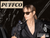 Woman in sunglasses using a Puffco device in a sleek, modern setting. Shop Puffco concentrate vaporizers now at Consider It Flowers.