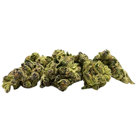 Premium Smalls Space Ghost THCA flower showing dense forest-green buds with crystalline trichomes.  